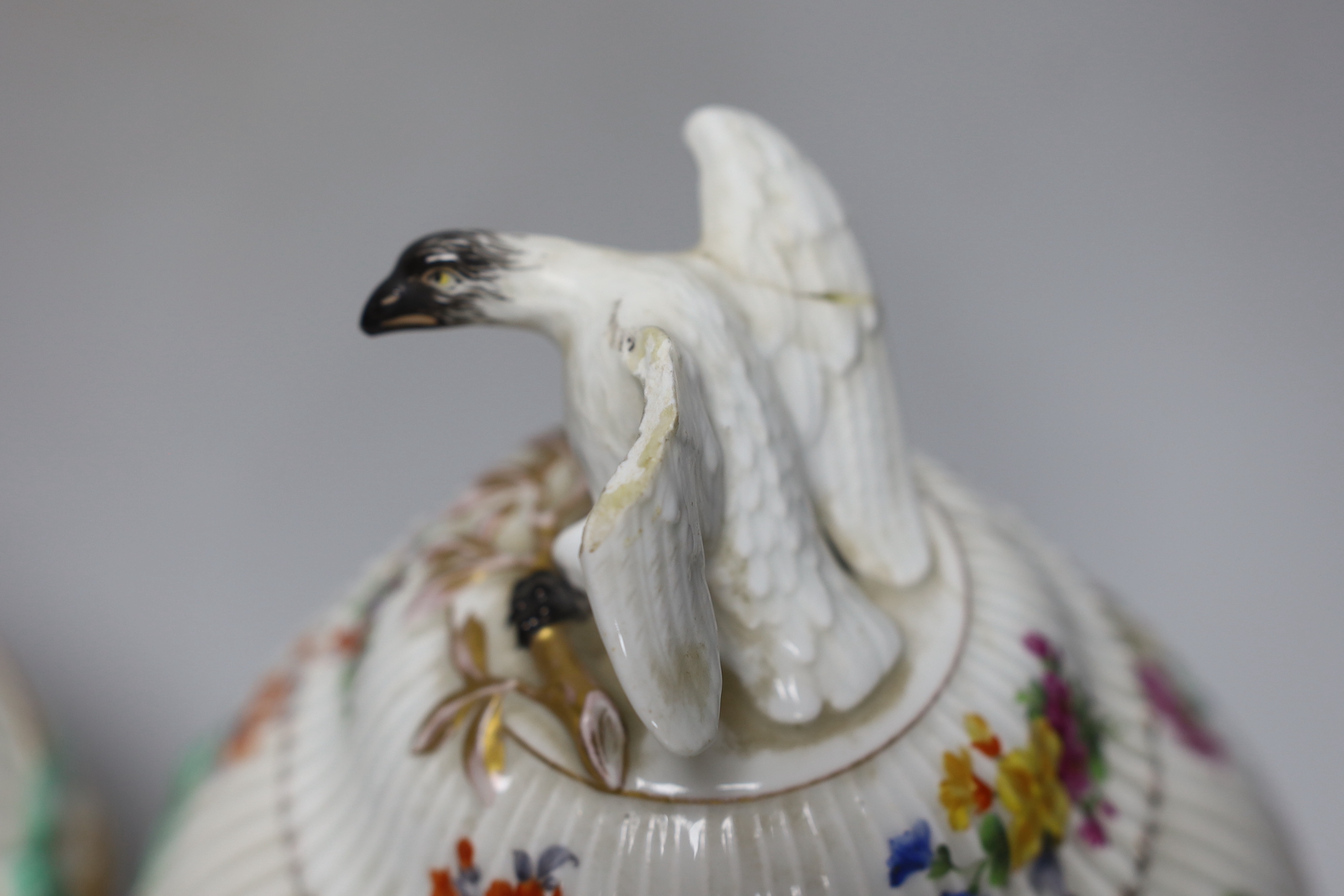 Two Dresden porcelain vases with bird decoration finials, and central horse scenes display, 30cm tall